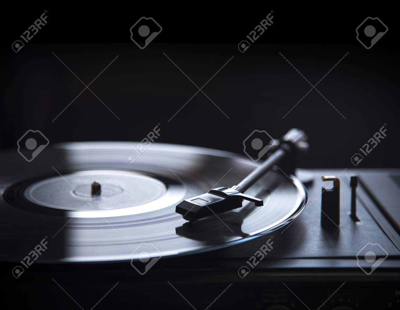 Retro Gramophone Vinyl Player Over Black Background With Copyspace