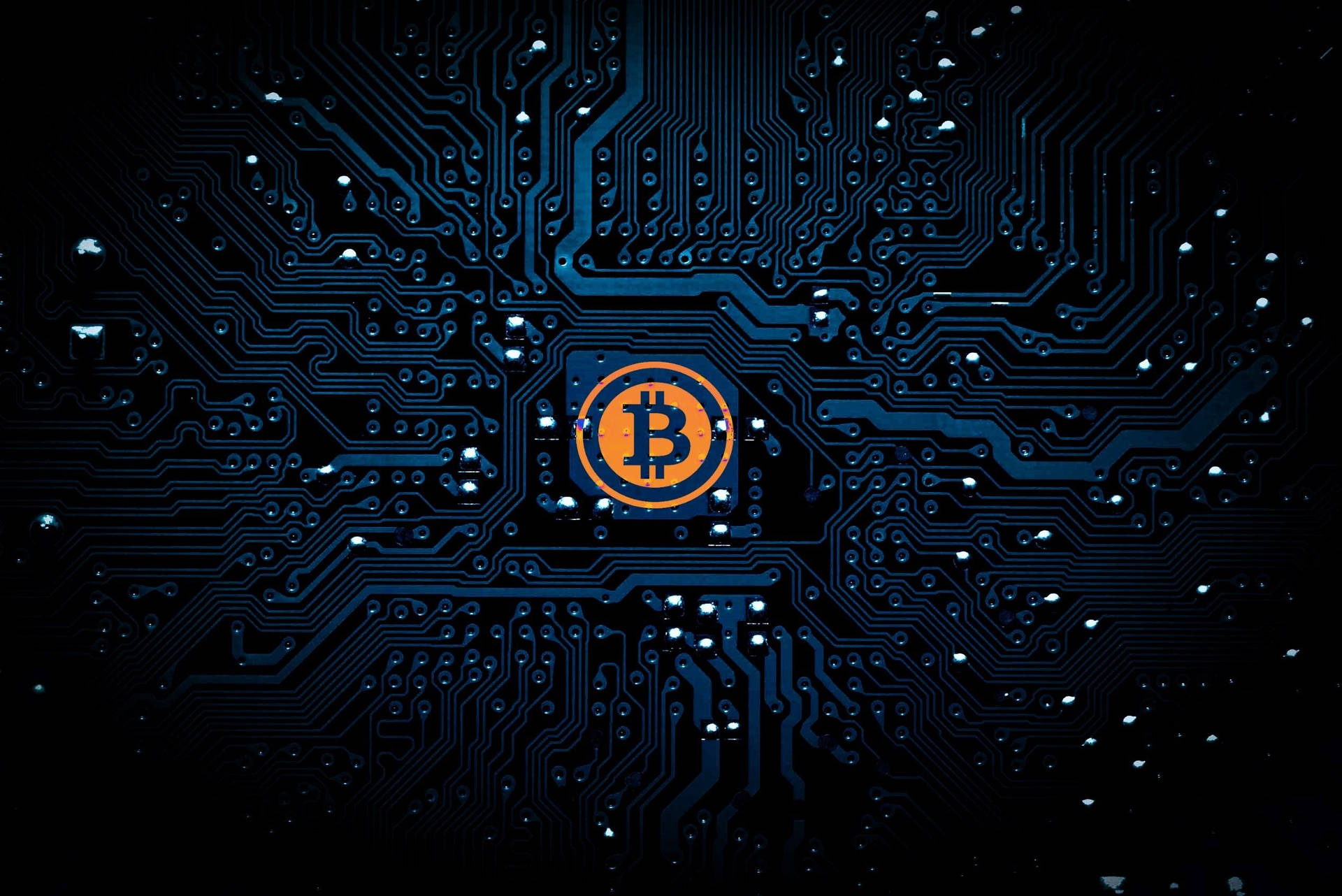 Bitcoin logo on a dark circuit board background, symbolizing the digital and technological nature of cryptocurrency