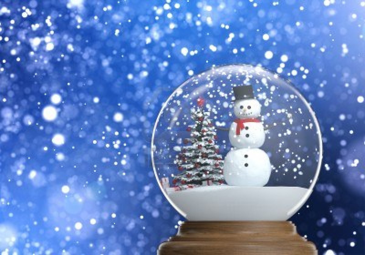 Snowglobe With Snowman And Christmas Tree Inside On A Blue