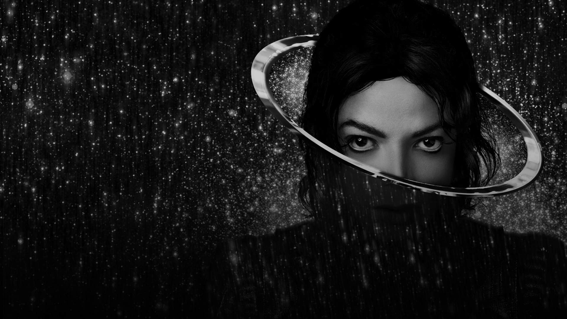 Black and white image of Michael Jackson with a ring around his head against a starry background