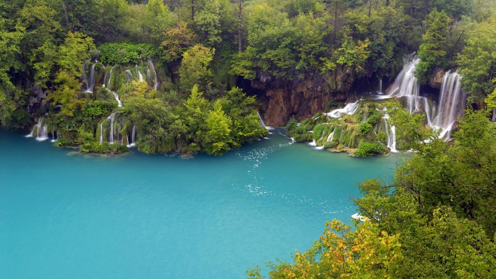 Waterfall In Blue Lagoon Wallpaper
