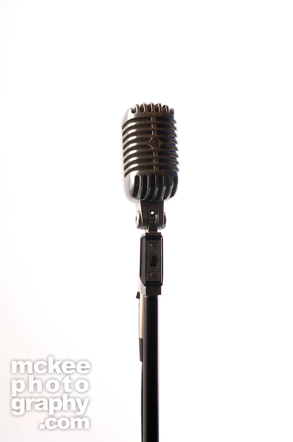1940 s style radiator microphone on white background facing the