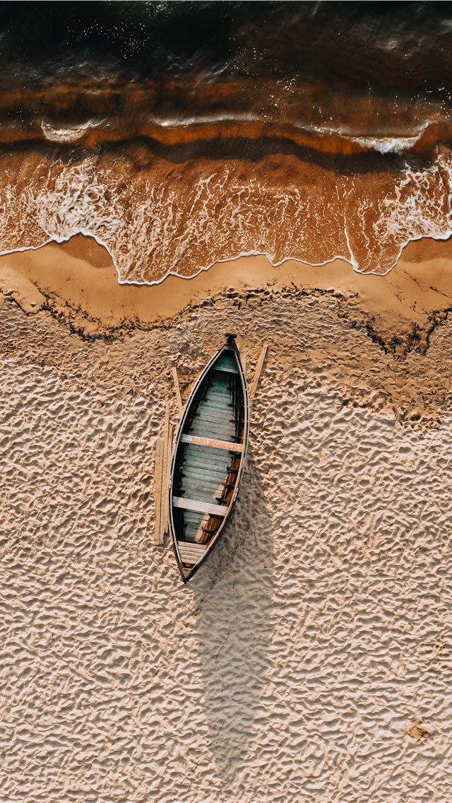 Brown And White Boat On Sand iPhone Wallpaper