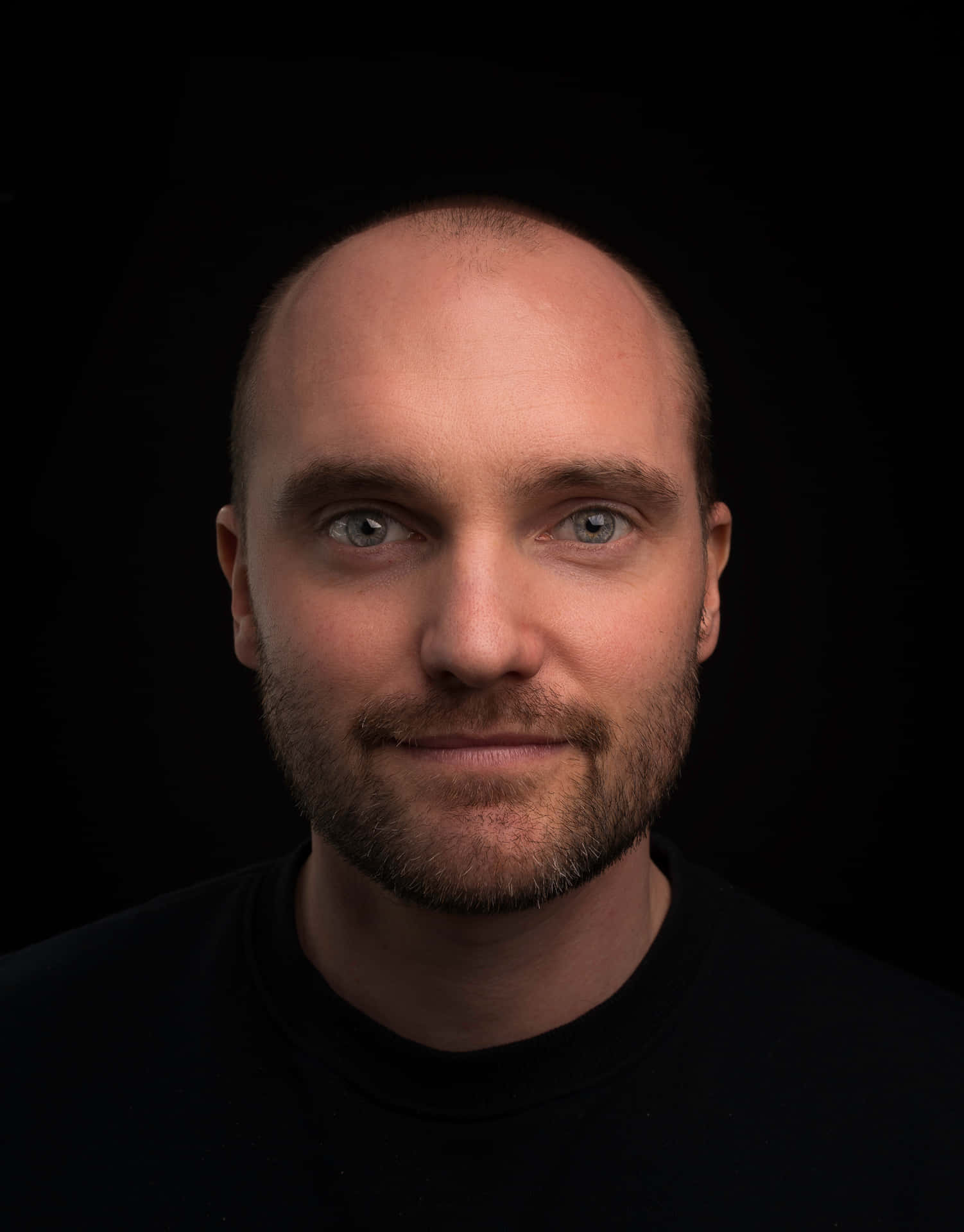 Portrait Of A Bald Man Smiling Wallpaper