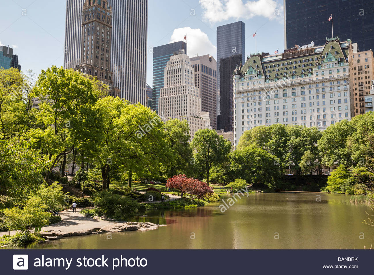 Central Park Pond With Plaza Hotel In Background Nyc Stock Photo