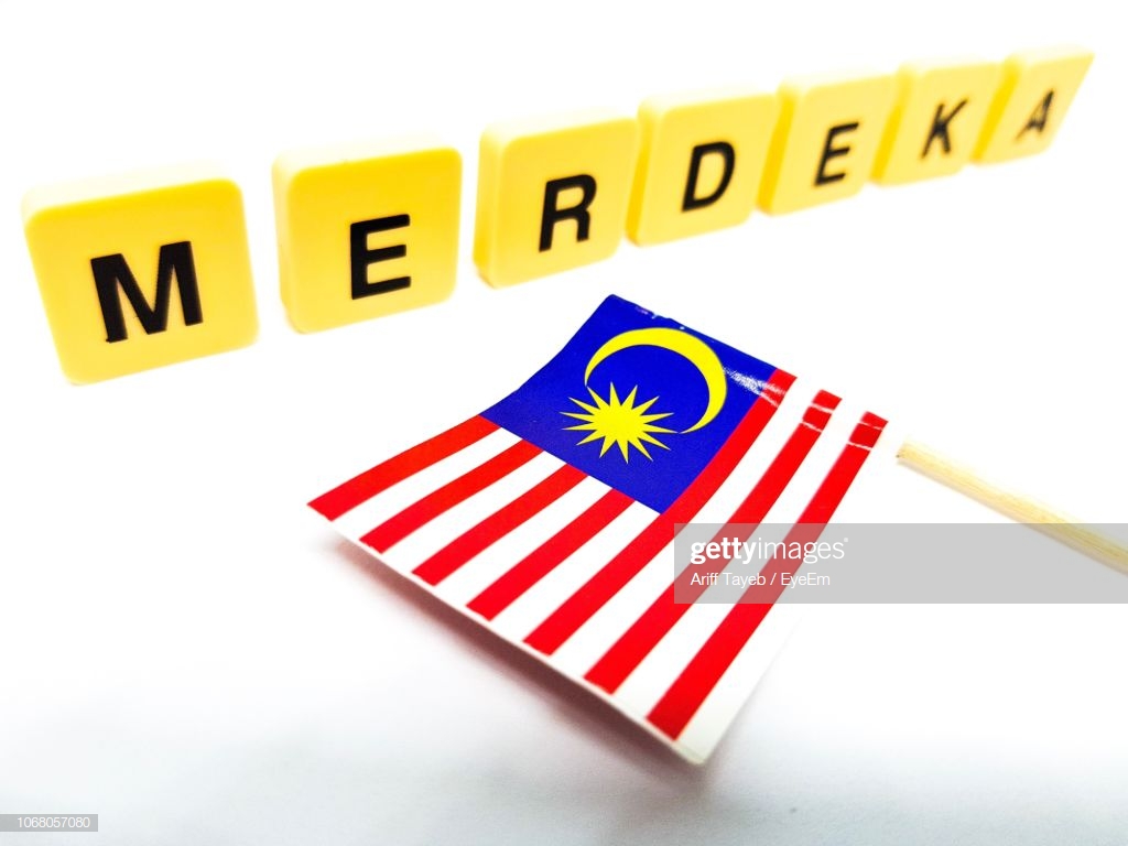 Closeup Of Malaysian Flag And Text Over White Background Stock