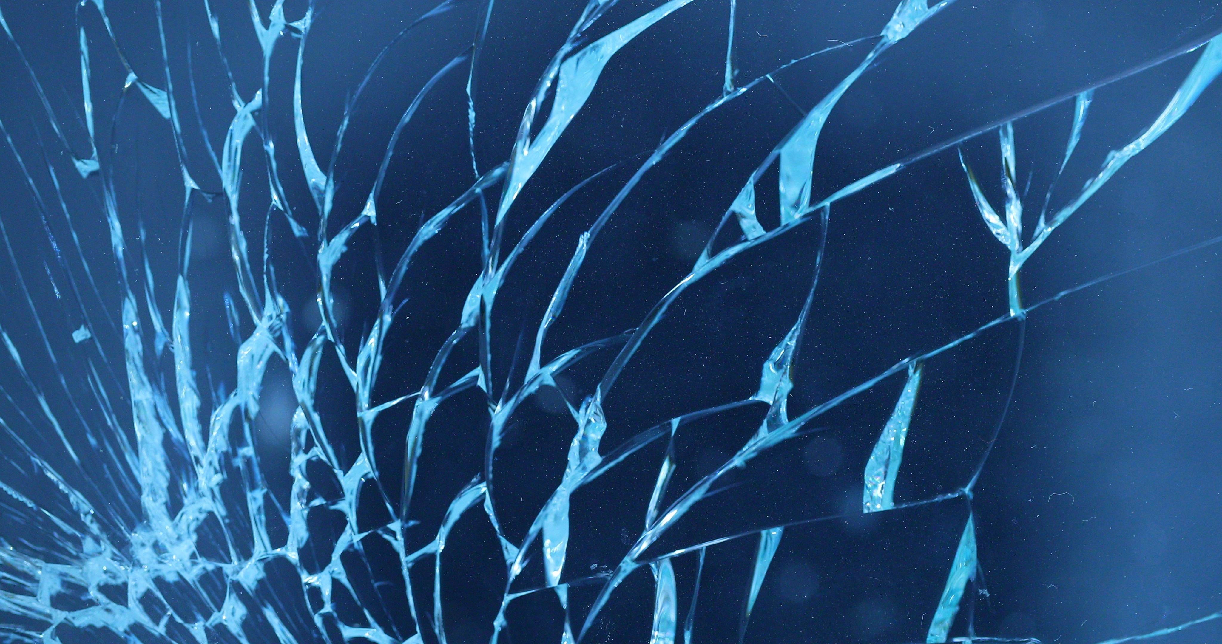 Shattering Glass On Blue Background Breaking Window Screen