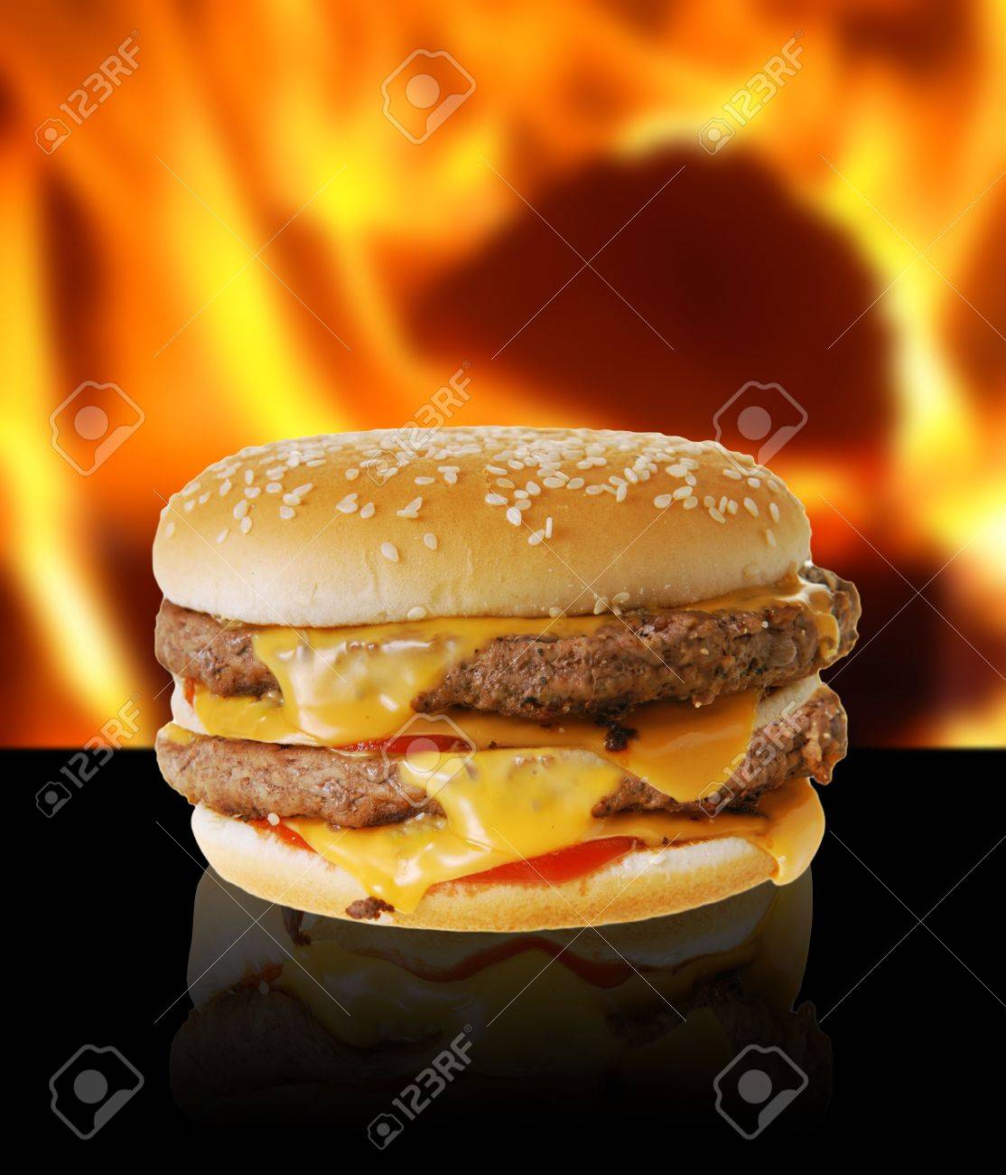 Double Cheeseburger On Flaming Background Stock Photo Picture And