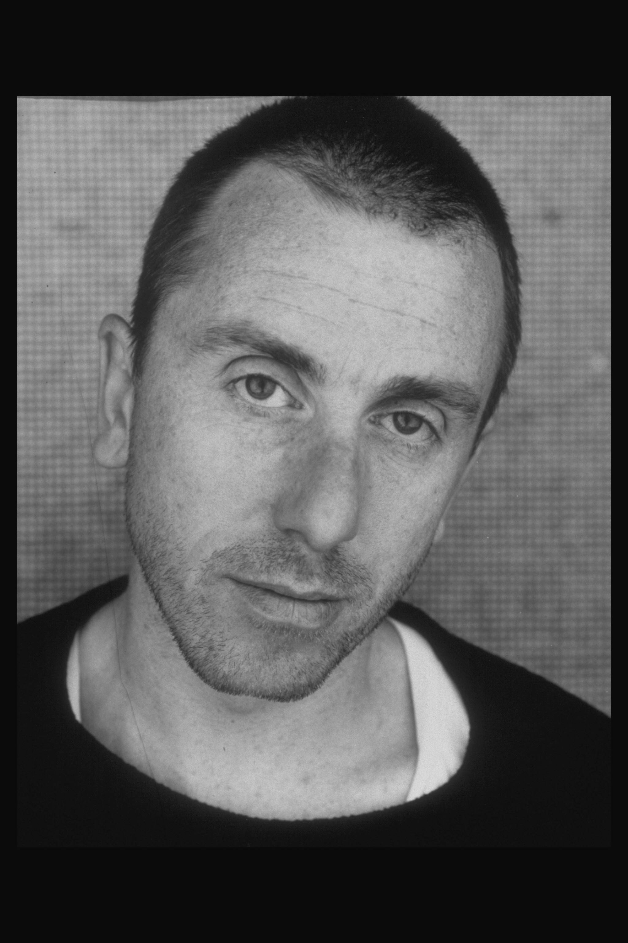 Young Tim Roth Buzzcut Portrait Wallpaper