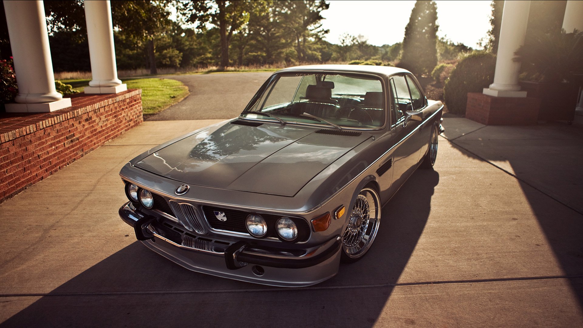 A Classic BMW E9 Coupe Parked in a Driveway