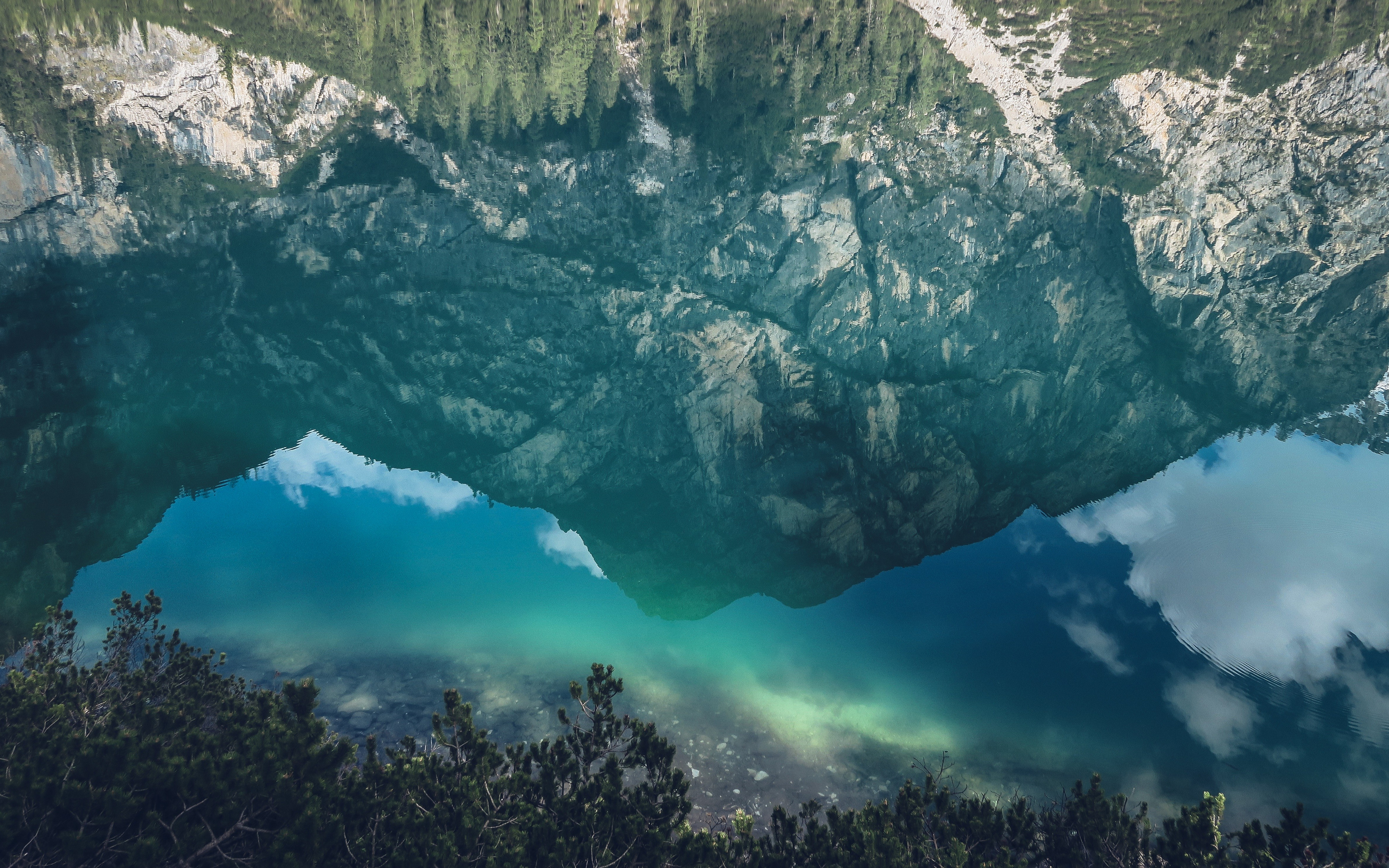 A mesmerizing reflection of a mountain in a pristine alpine lake, creating a surreal and inverted landscape