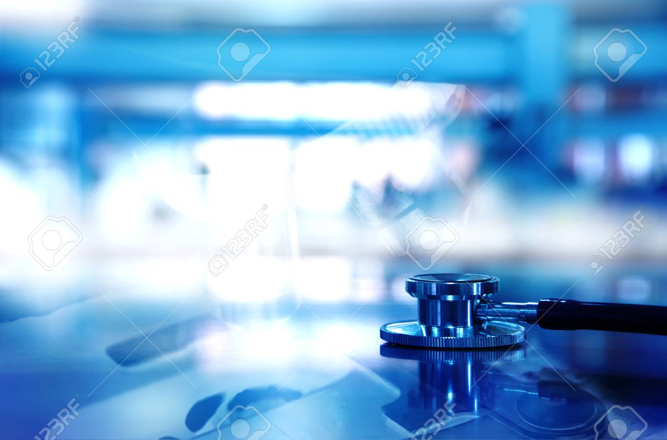 Stethoscope For Doctor Diagnosis With Microscope Background In