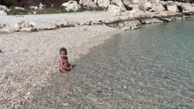 Wet Toddler Shivering With Cold At The Seashore