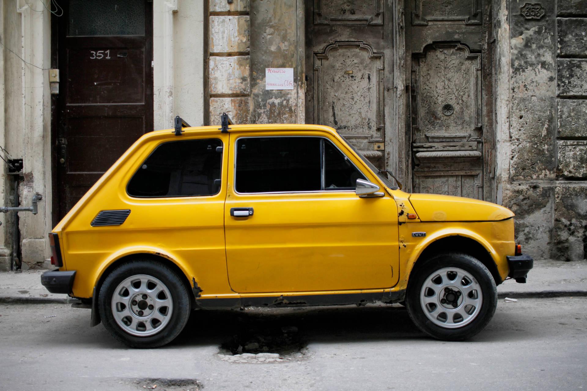 Yellow Fiat In Cuba Wallpaper