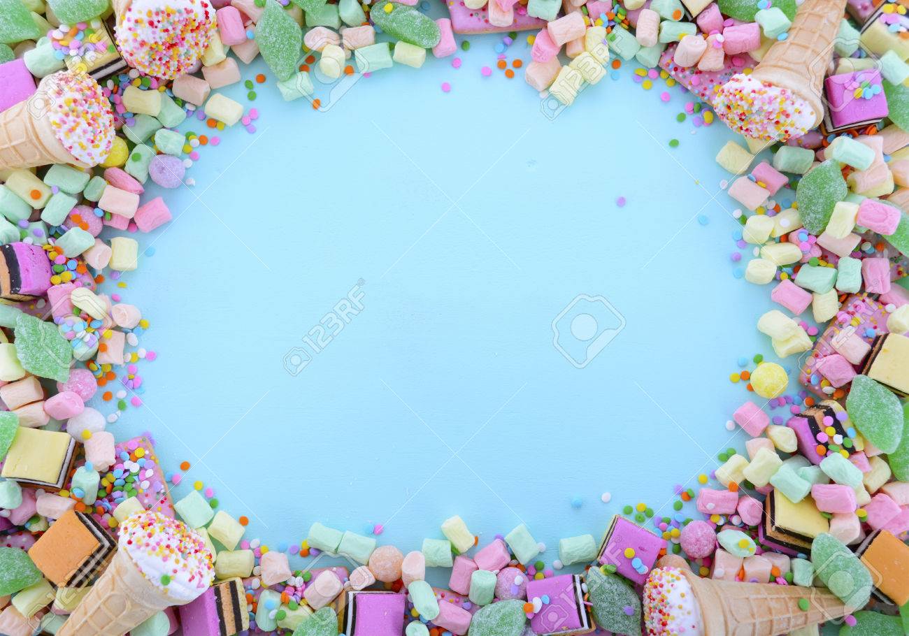Bright Colorful Candy On Pale Blue Wood Table Background With