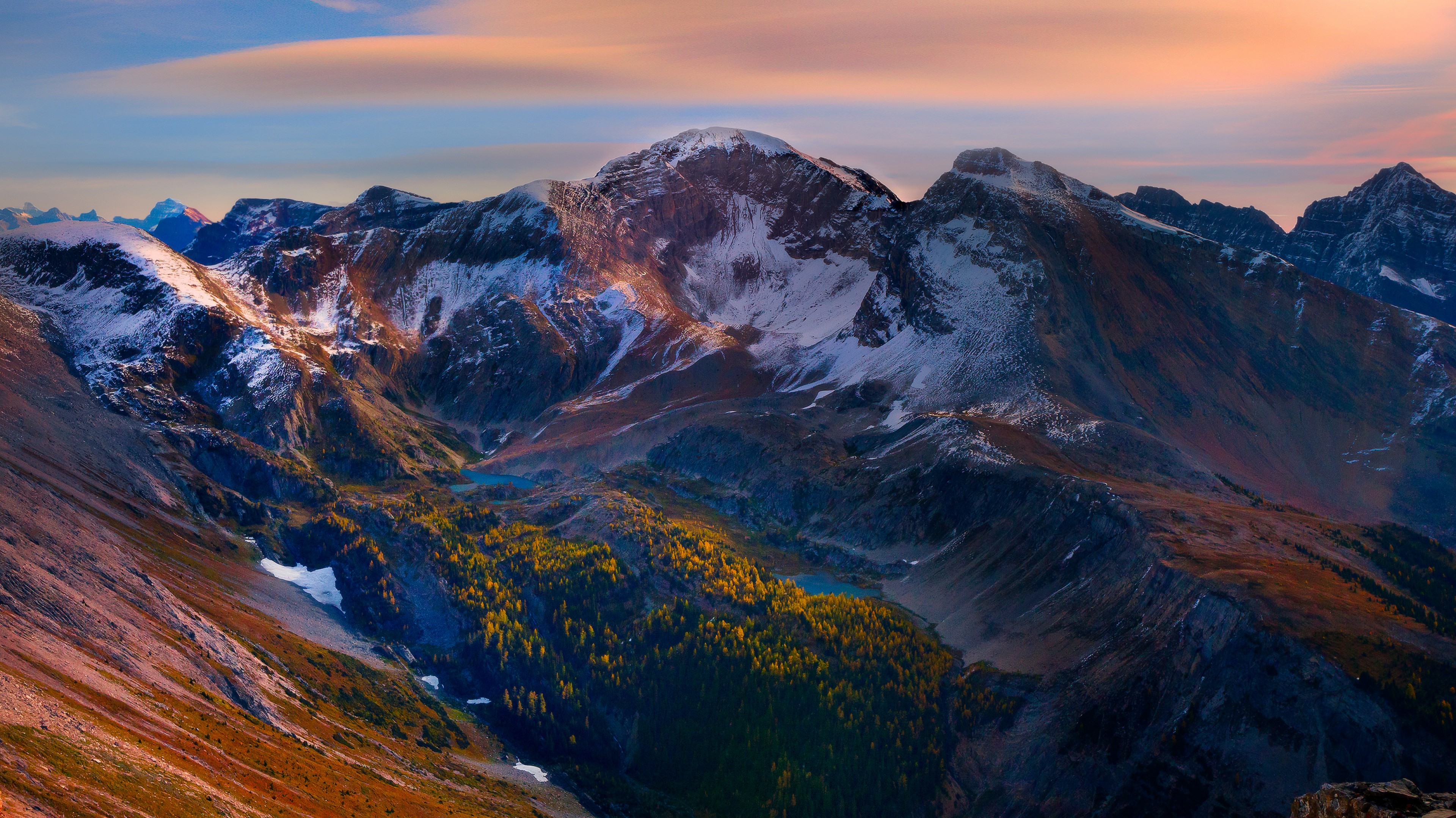 Sunrise over snow-capped mountains with autumn foliage, Banff National Park, Canada