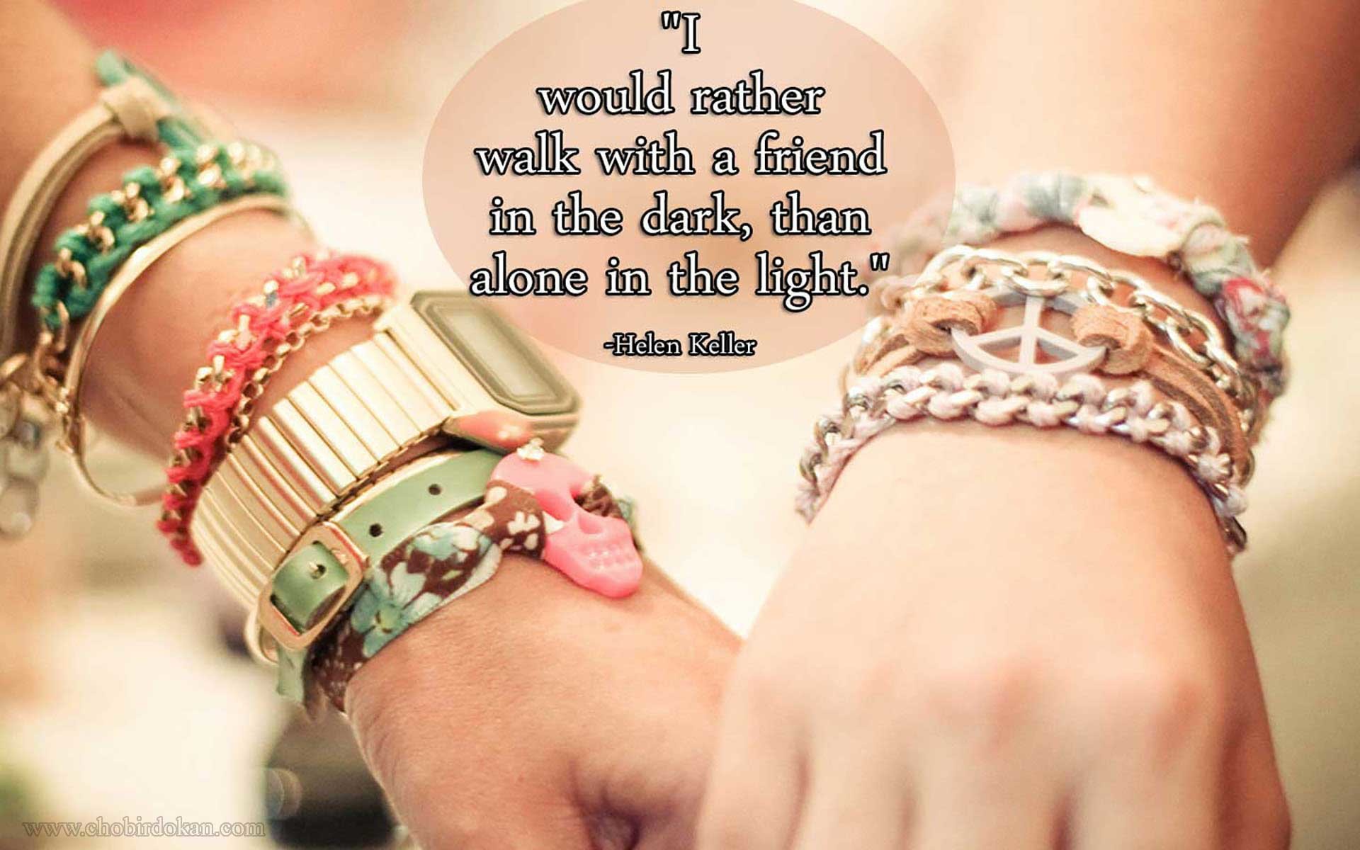 Two friends holding hands, symbolizing the strength and comfort of friendship, with a quote by Helen Keller about preferring to walk with a friend in the dark than alone in the light