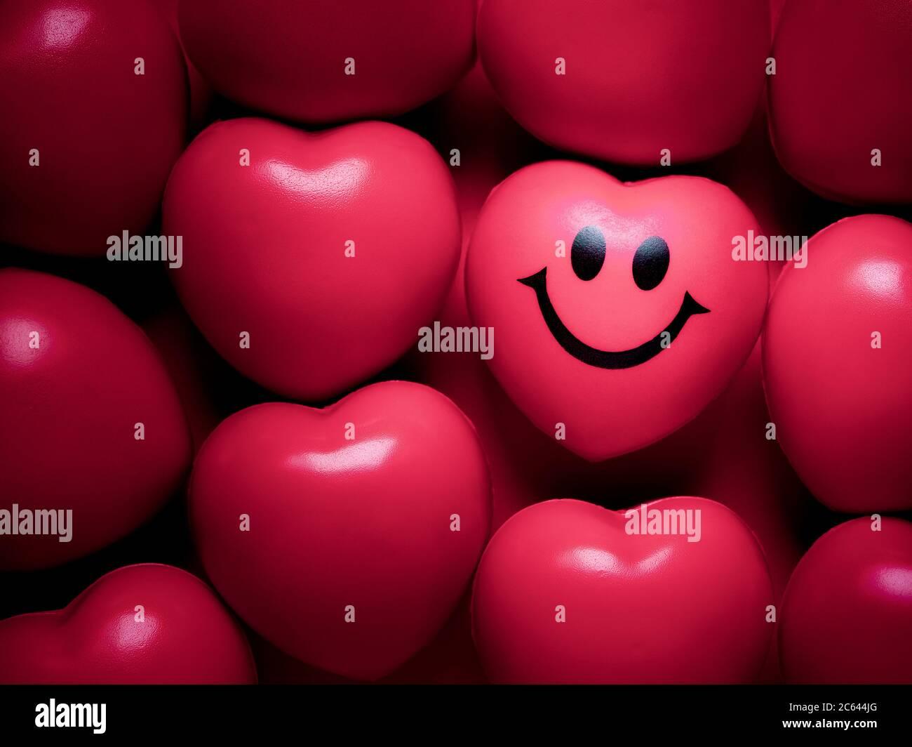 Hearts Background Pink Heart With Happy And Smiling Face Among