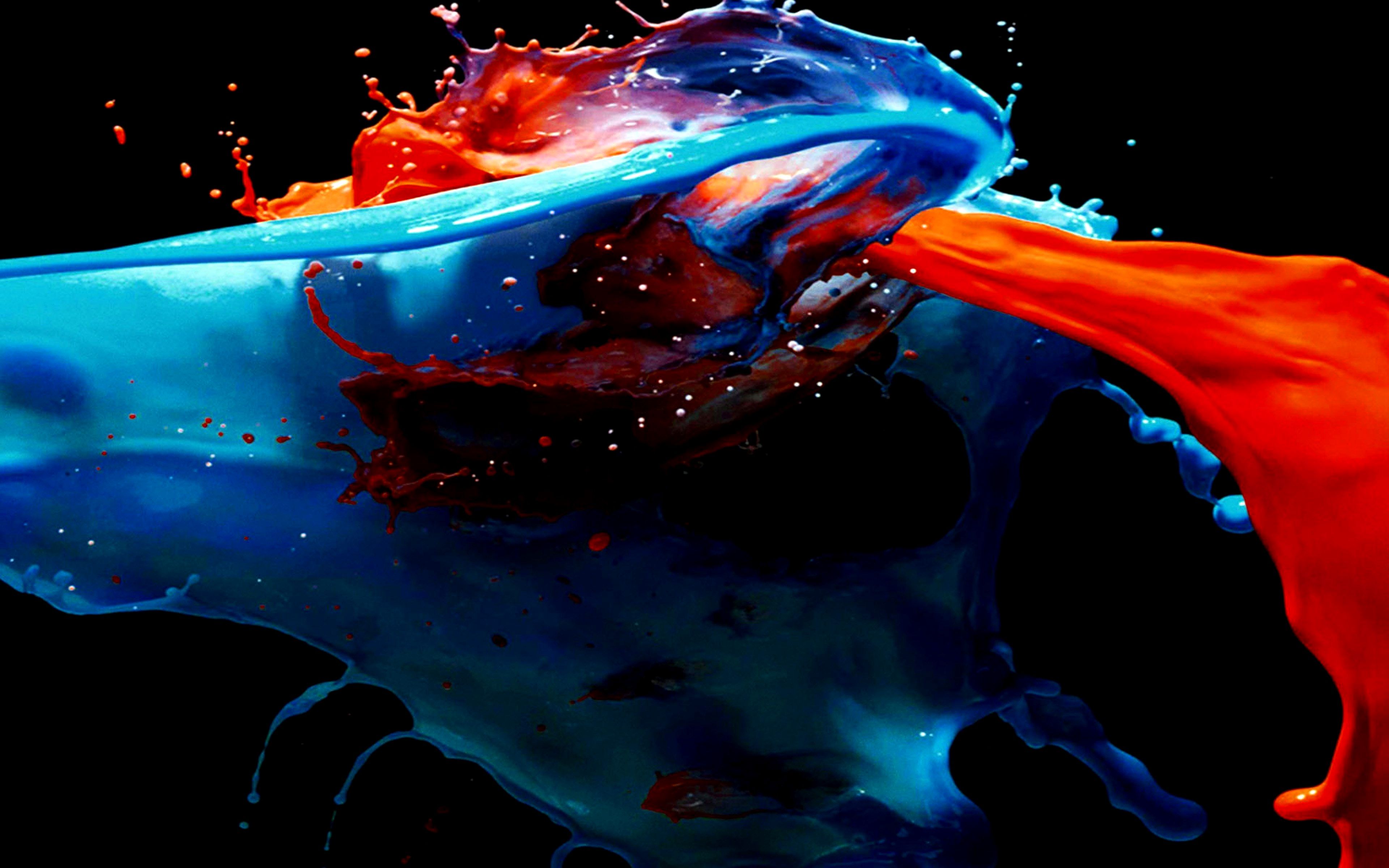 Dynamic Splash of Blue and Red Paint on a Black Background