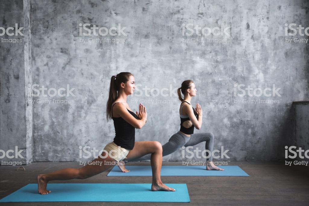 Acroyoga Practice Pair Sporty Yoga Women Doing Exercise On Gray