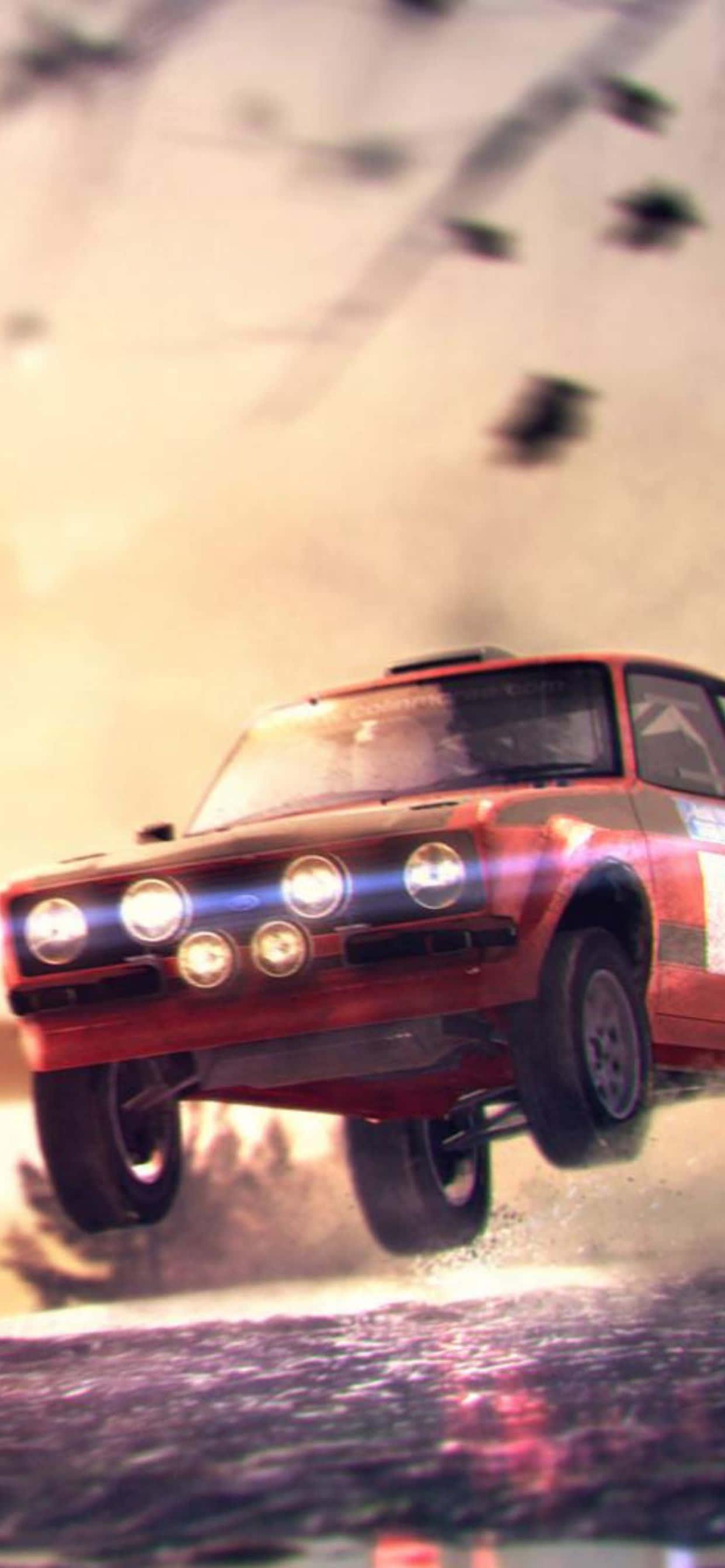 A Red Car Is Flying Through The Air Wallpaper