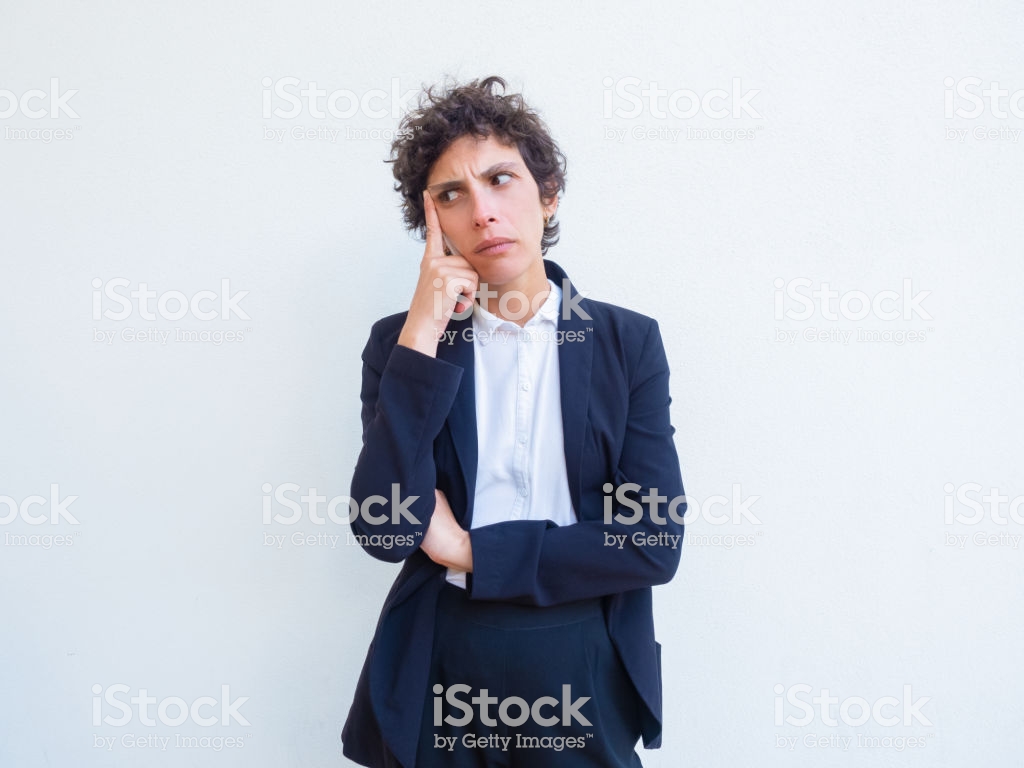 Pensive Serious Businesswoman Leaning Head On Hand Stock Photo