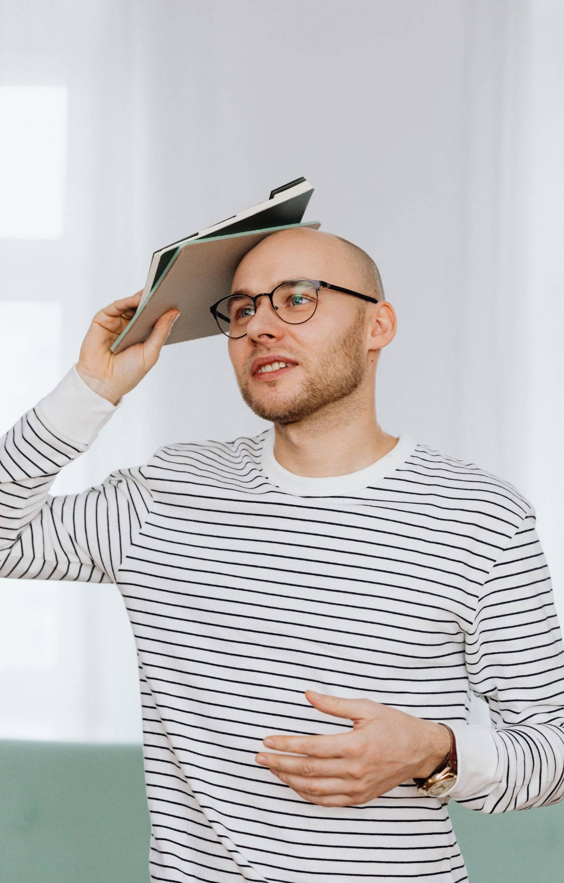 Bald Man With Books Wallpaper