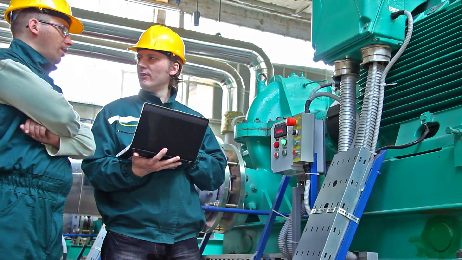 Industrial Workers With Notebook Working In Power Plant Happy And