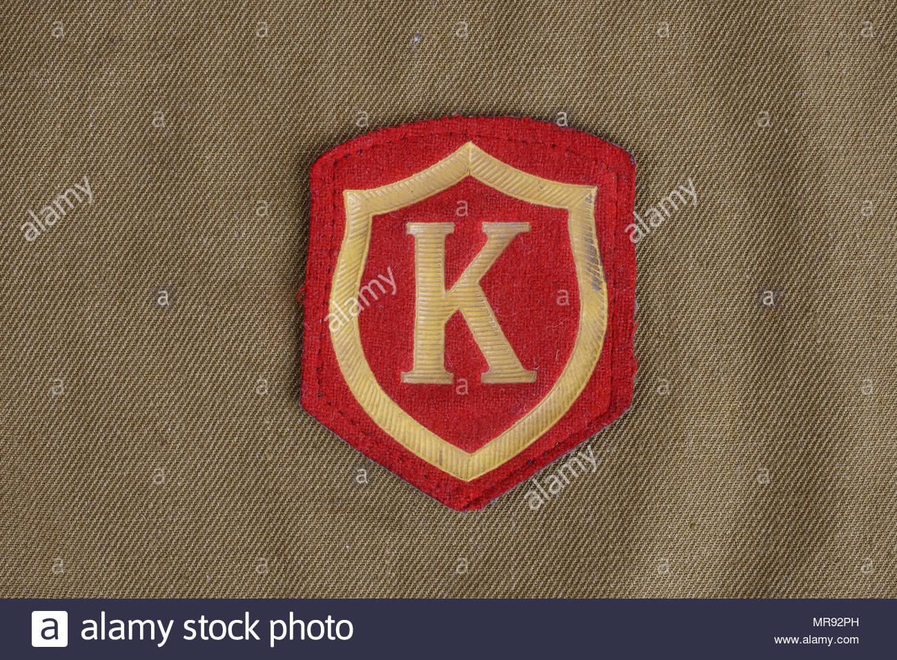 Soviet Army Mandant Shoulder Patch On Khaki Uniform Background