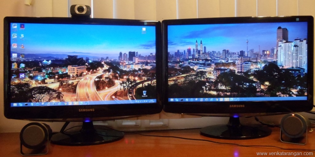 Monitors Showing The Awesome Cityscape Panoramic Wallpaper In Windows8