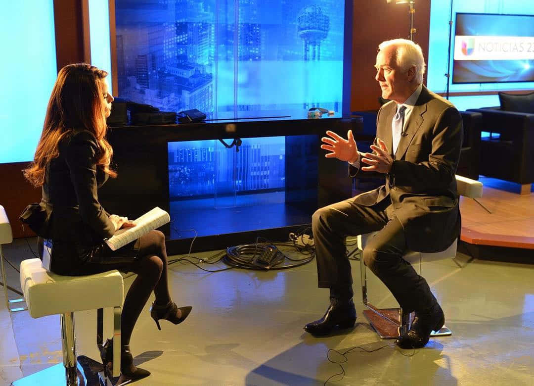 John Cornyn Being Intered By A Woman Wallpaper