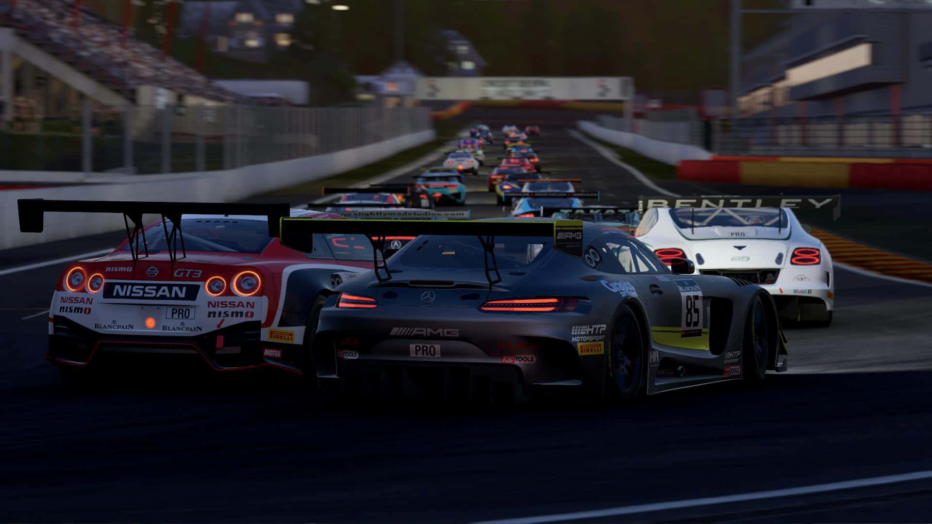 A Race Car Is Driving Down Track Wallpaper