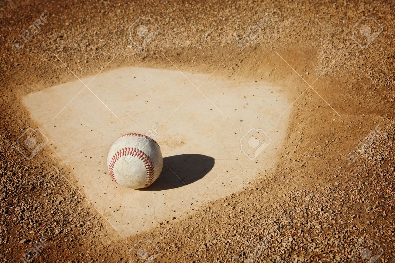 A Baseball Sitting On Home Plate Great Sports Background Stock