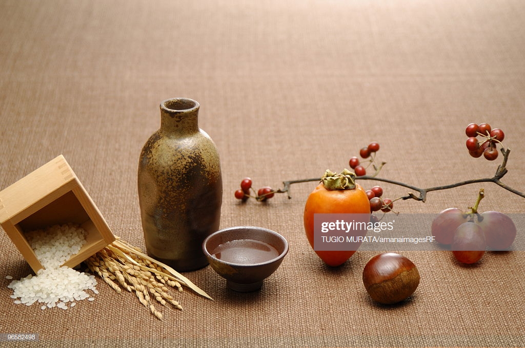 Sake Rice And Fruits On Brown Background Stock Photo Getty Image