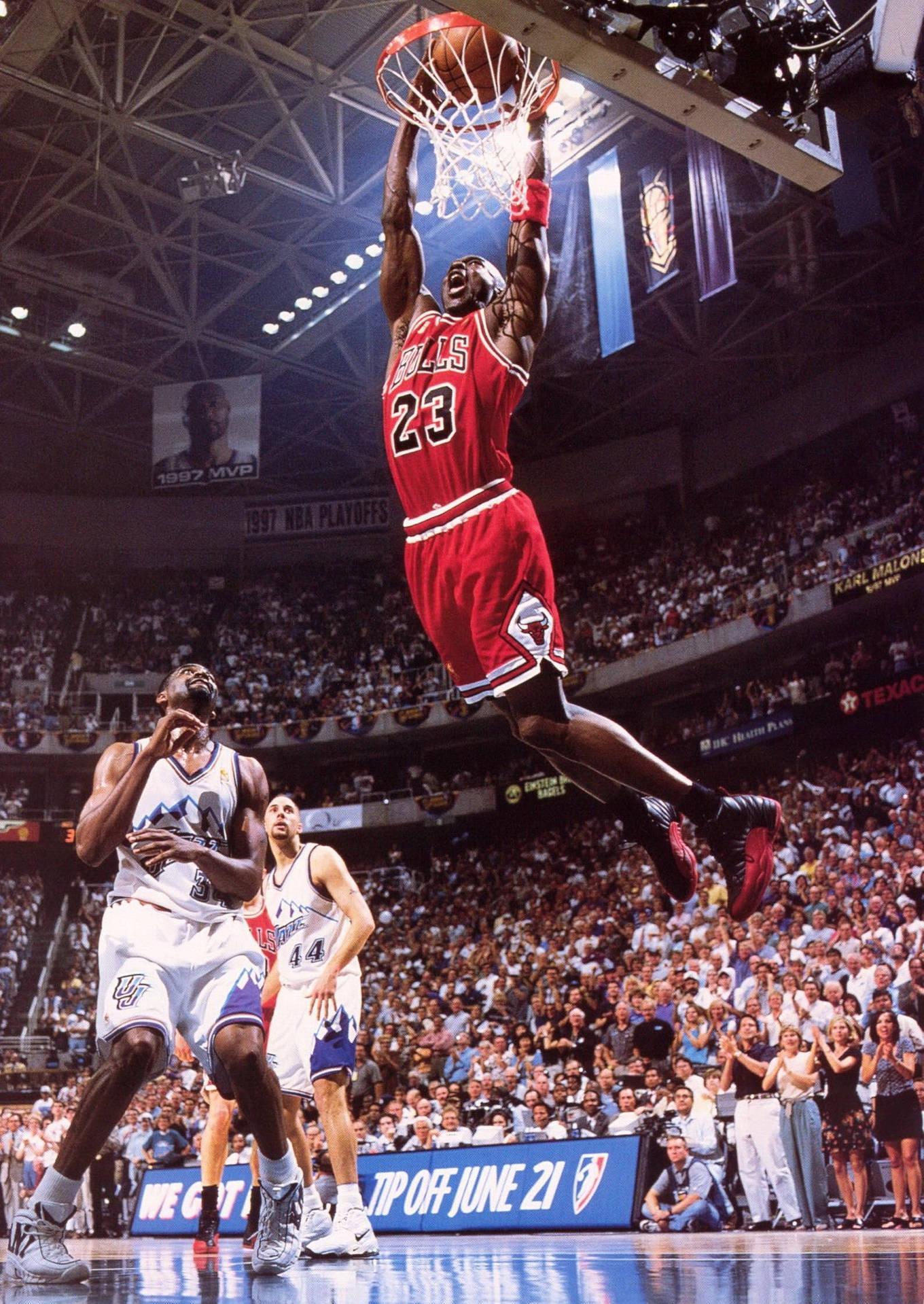 Michael Jordan Flies Through The Air Making A Legendary
