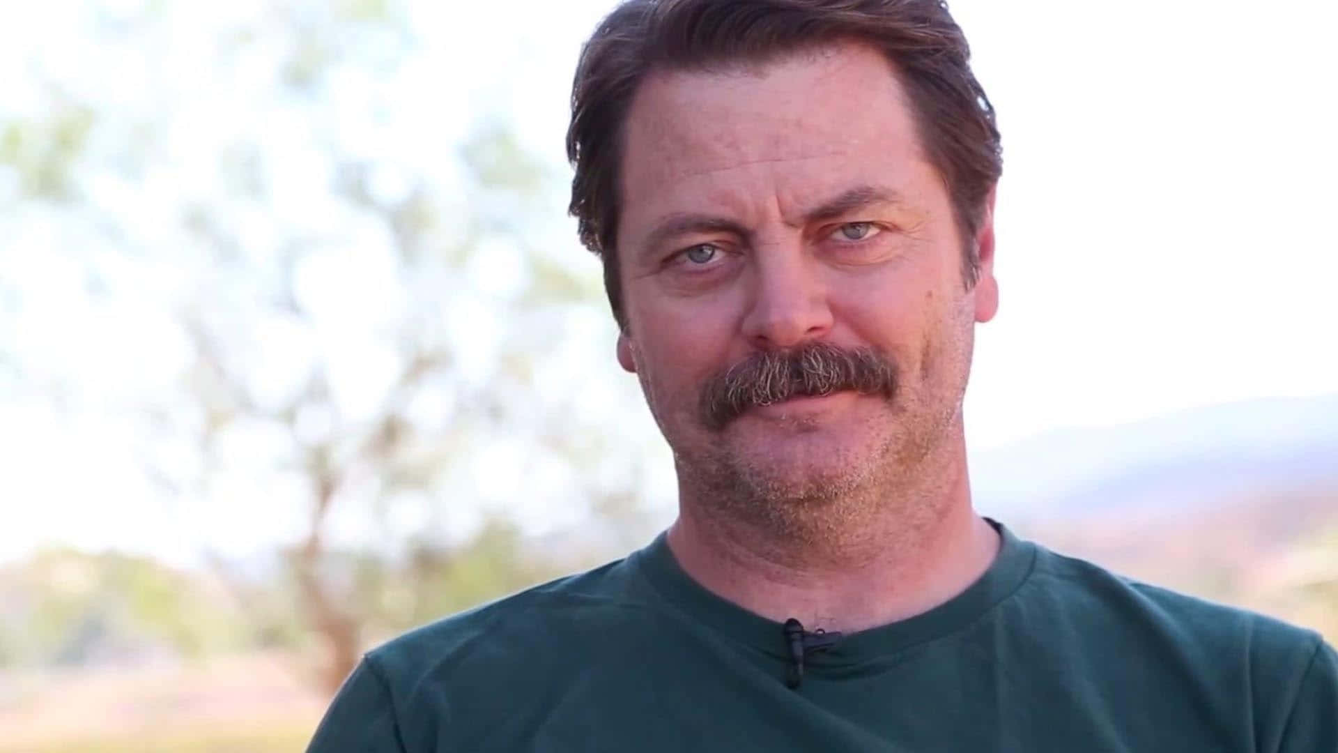 Nick Offerman Looks On In An Environment Of Nature And Peace Wallpaper