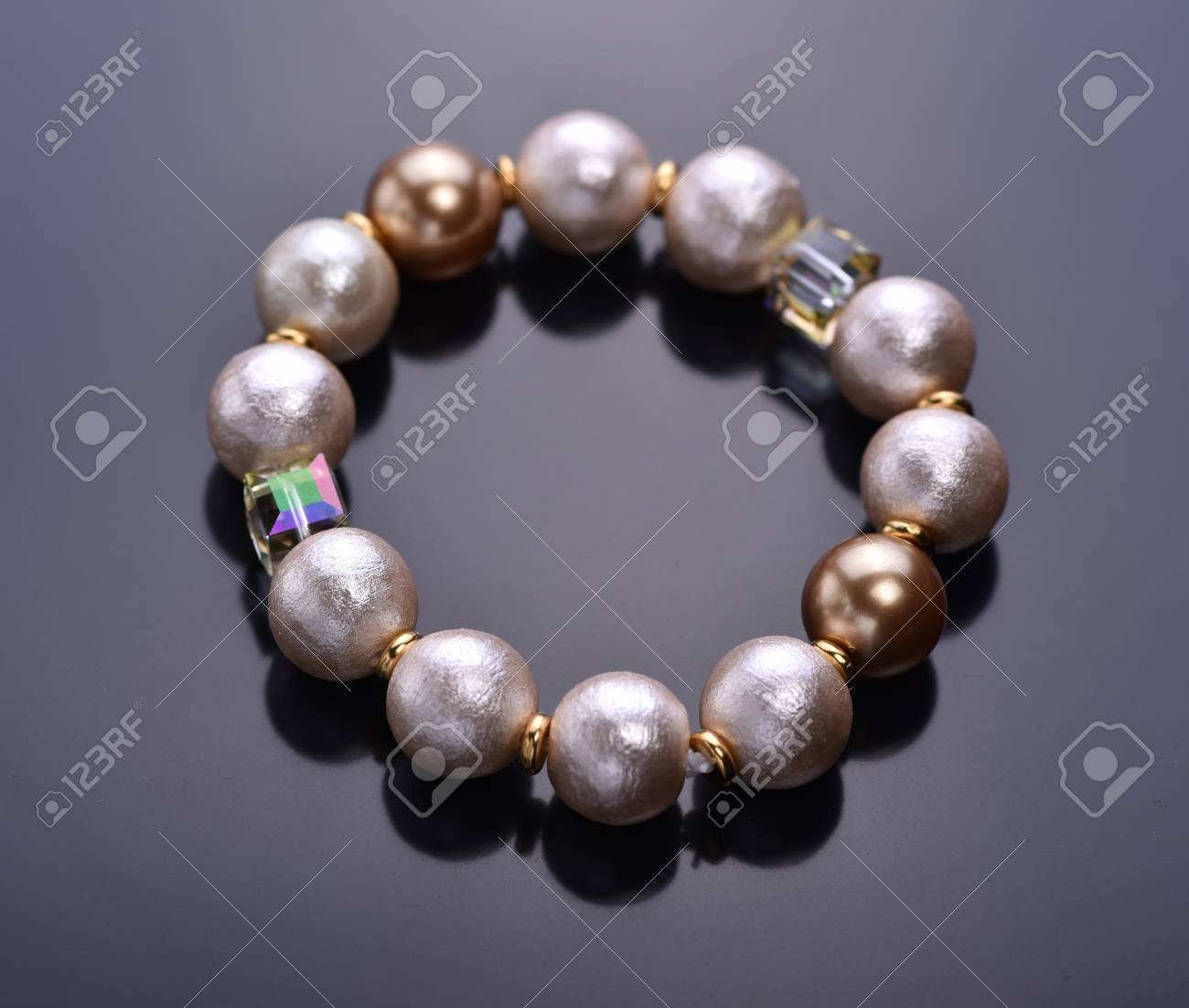 Pearl Bracelet With Crystals On A Dark Background Beadwork