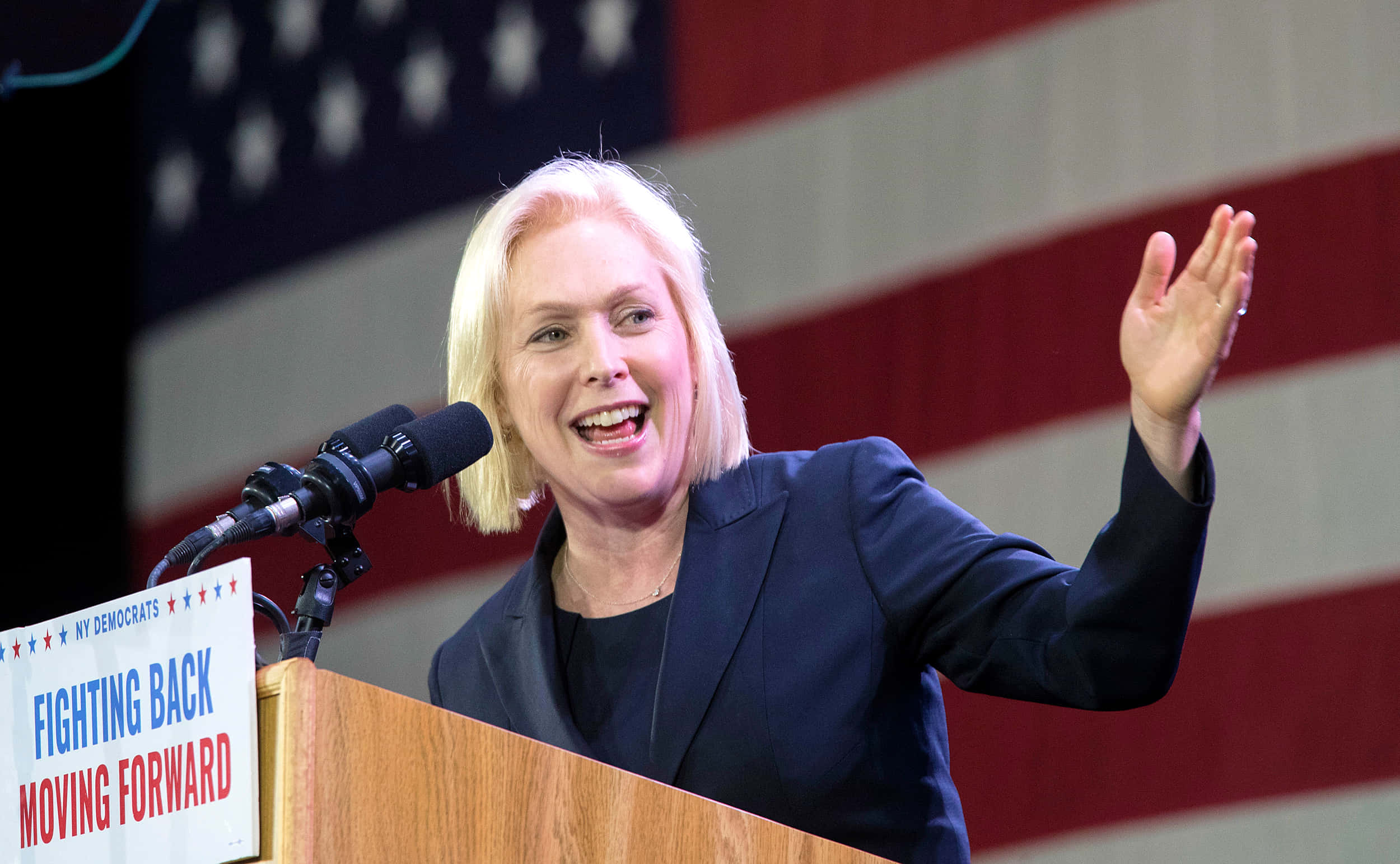 Kirsten Gillibrand Extending Left Hand Wallpaper