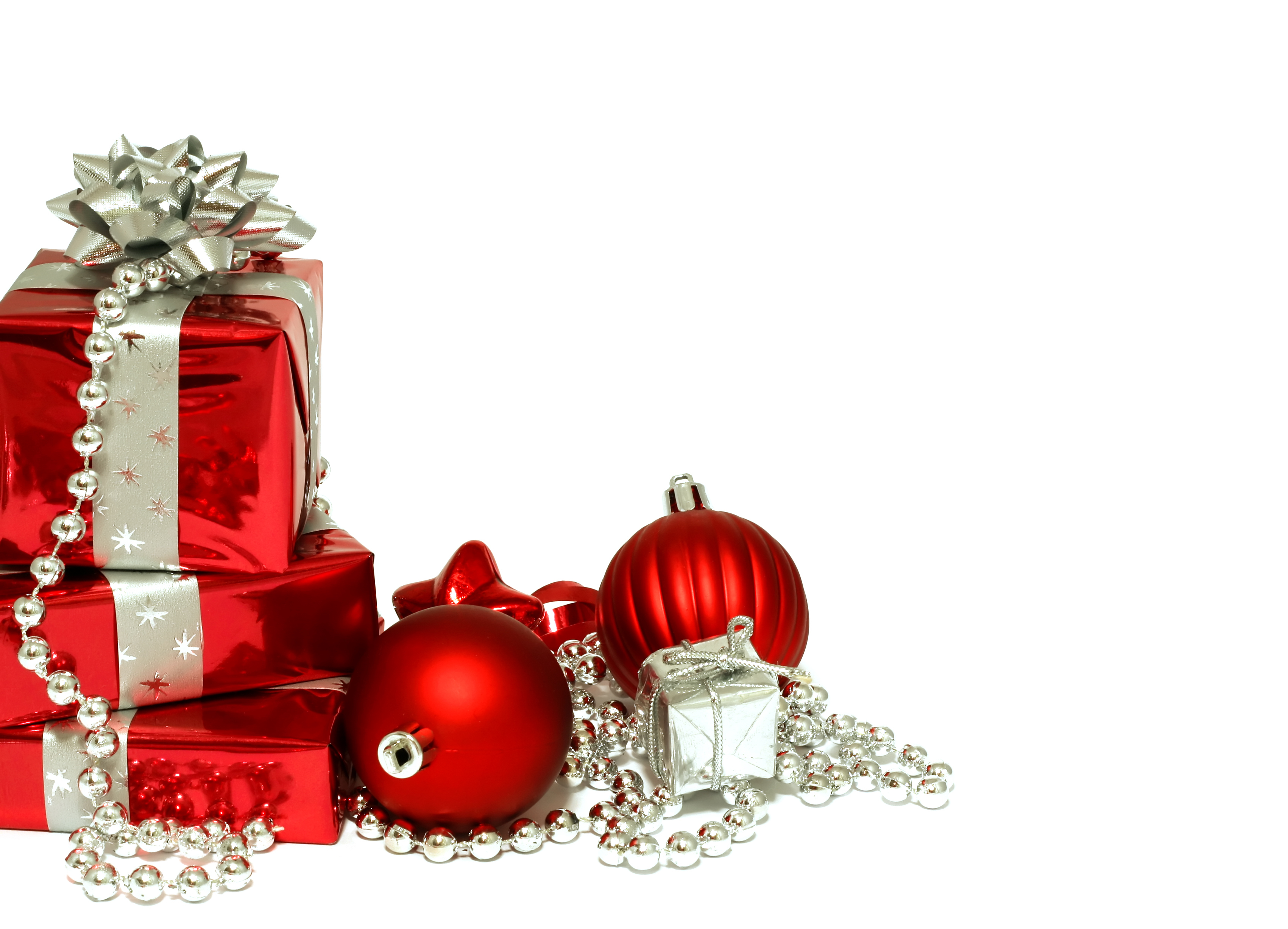 Red Christmas decorations and gifts on Christmas white