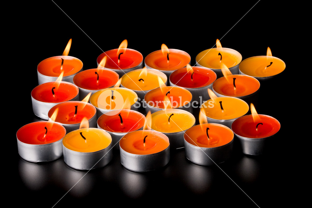 Flaming Candles On Black Background Royalty Stock Image