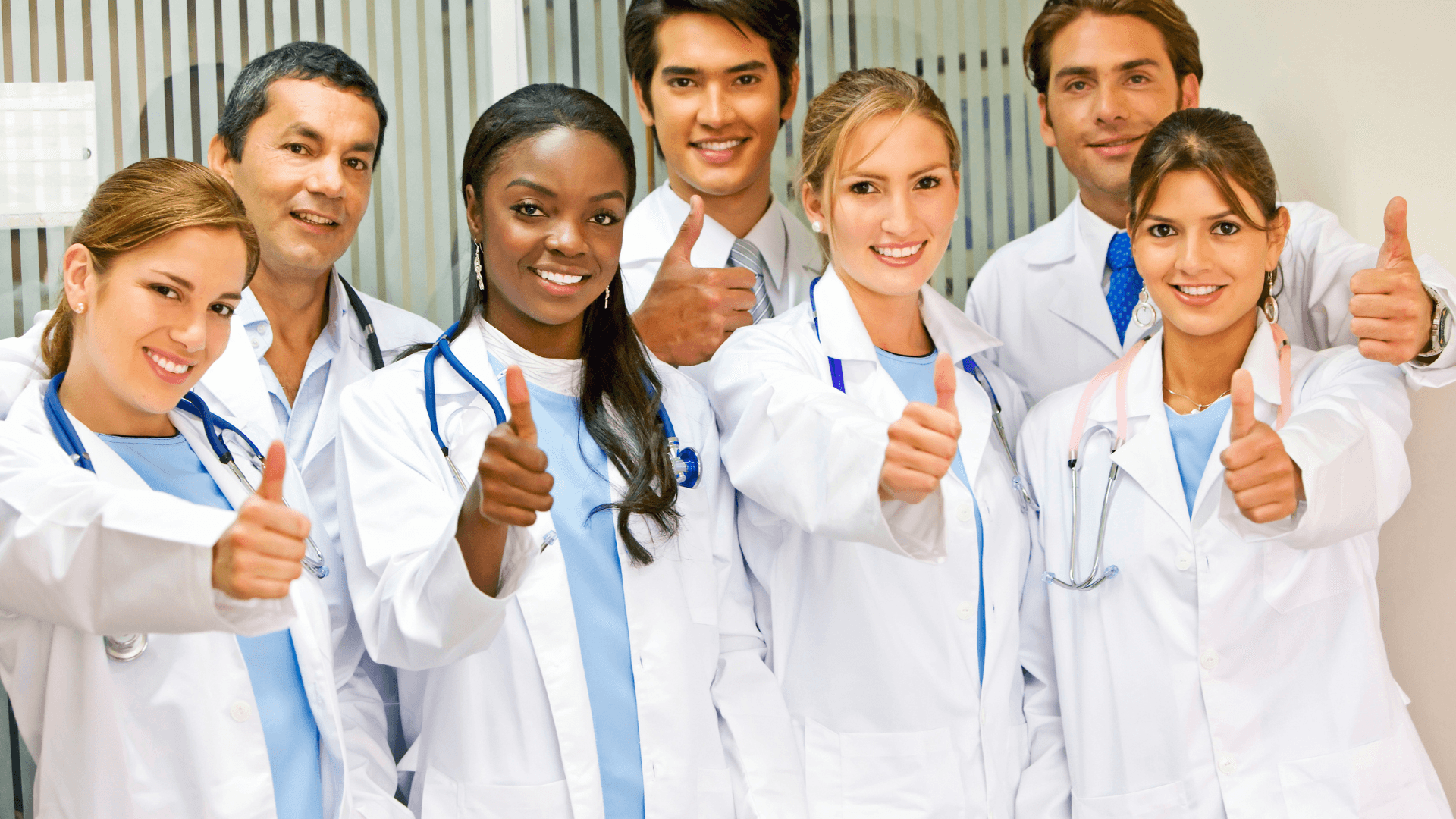 A Group Of Doctors Giving Thumbs Up Wallpaper