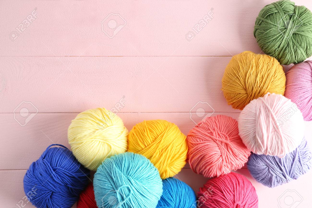 Balls Of Knitting Yarn On Color Background Stock Photo Picture