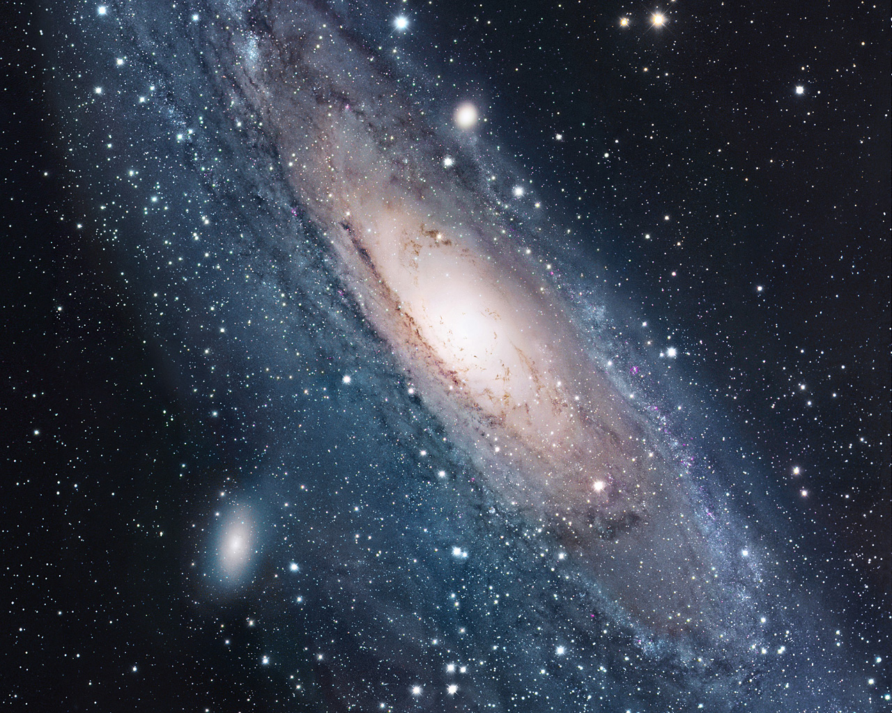 A stunning view of a spiral galaxy in the vast expanse of space, showcasing swirling dust lanes, bright stars, and dark nebulae