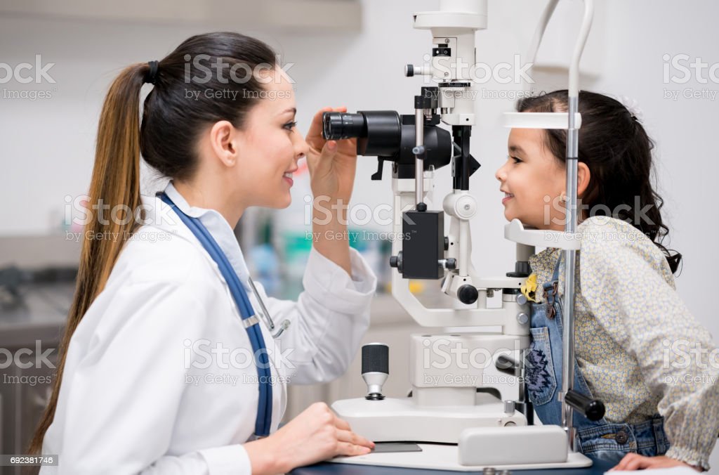 Girl Getting An Eye Exam At The Optician Stock Photo