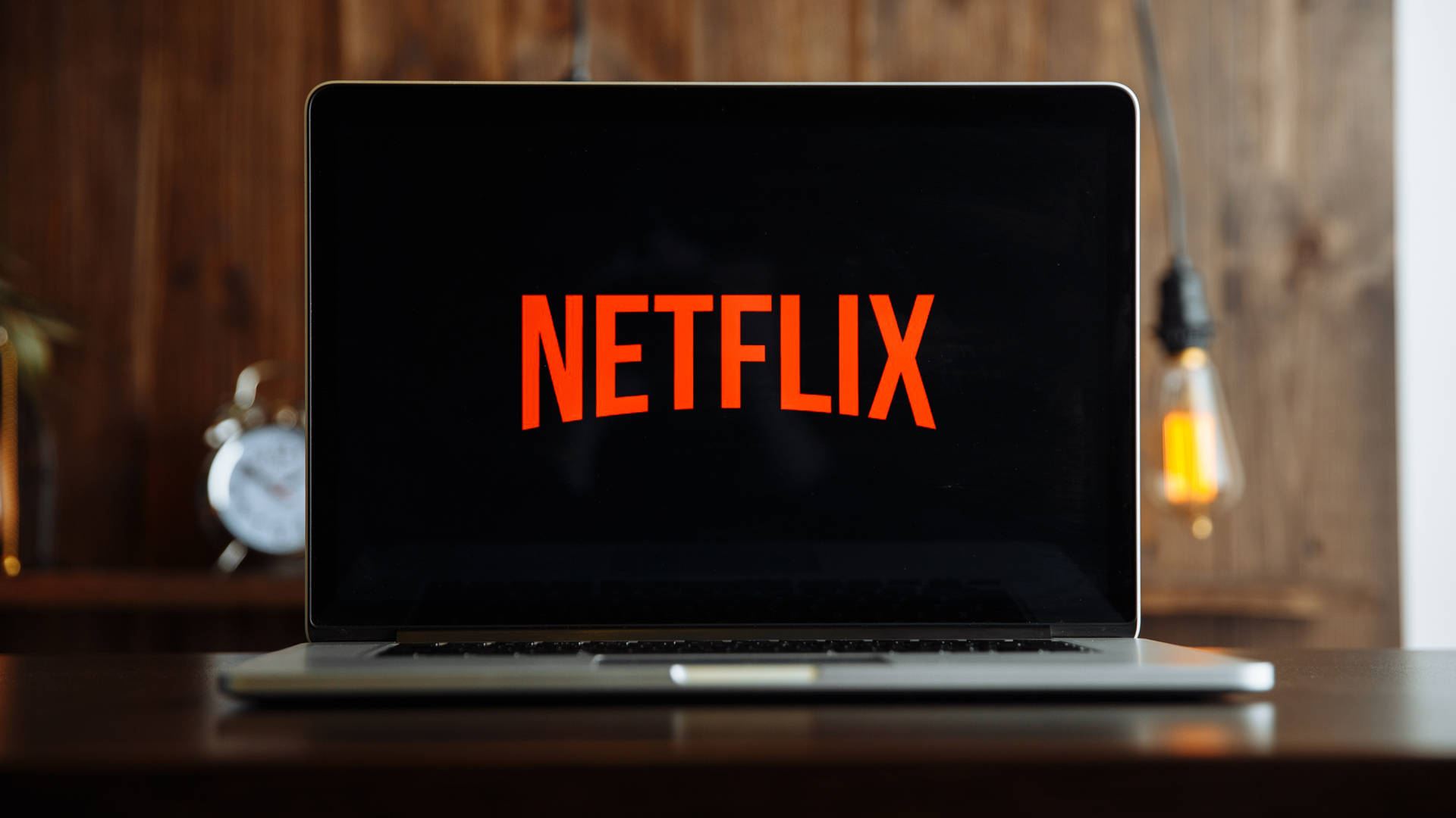 A laptop displaying the Netflix logo on its screen, suggesting the ease of streaming Netflix content on personal devices