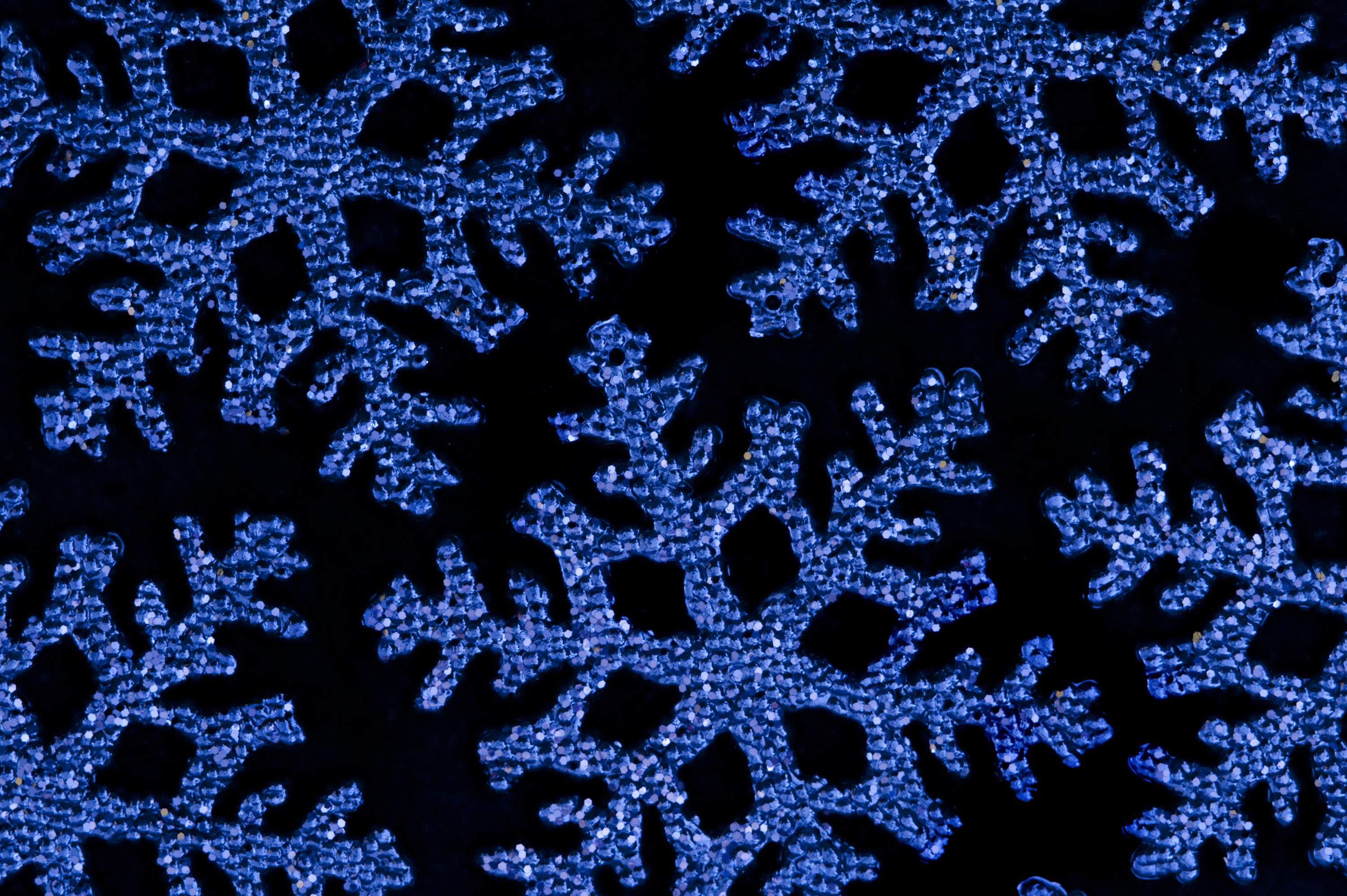 Blue Christmas Snowflake Shape Decorations On A Black Backdrop