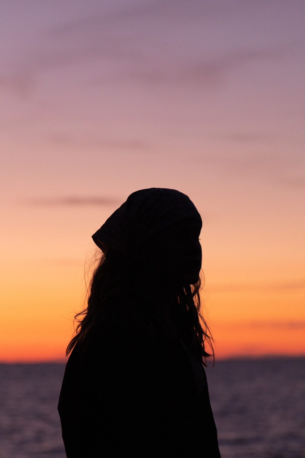 Silhouette Of Woman During Sunset Photo Image
