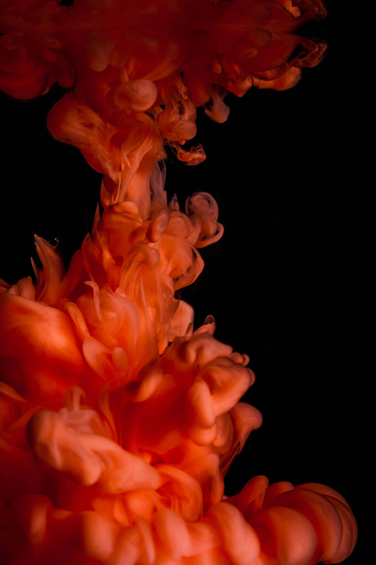 A Red Liquid Is Floating In Black Wallpaper
