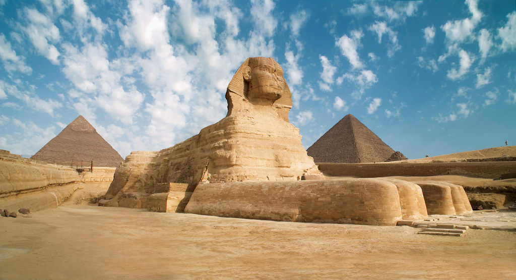 Egypt Giza Sphinx With Pyramids In The Background Source