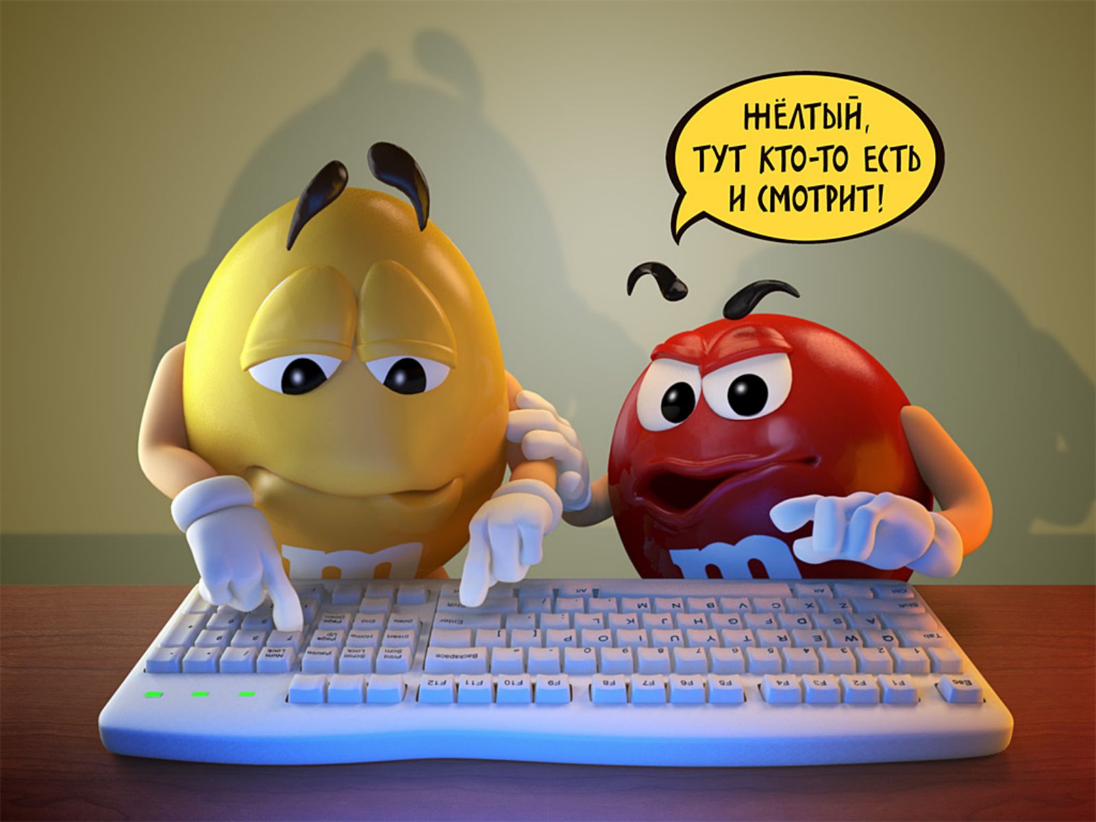 Two M&M characters humorously interacting with a computer keyboard, suggesting they are being watched